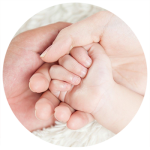 parents holding baby hands